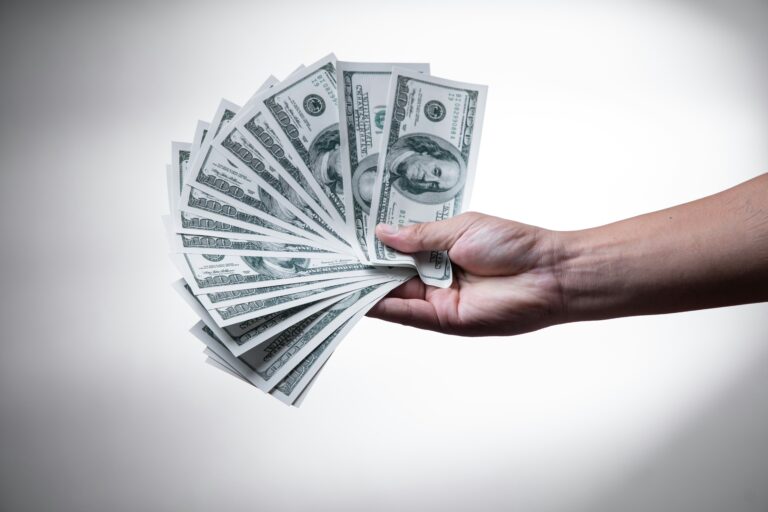 In this illustartion, client showing usds in his hand