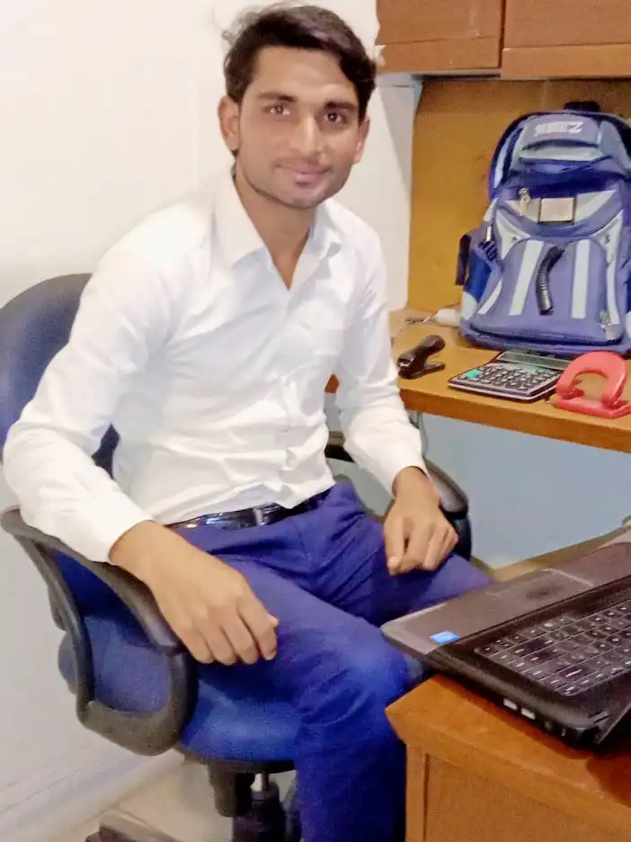 Founder of FabTechy Working on a Laptop