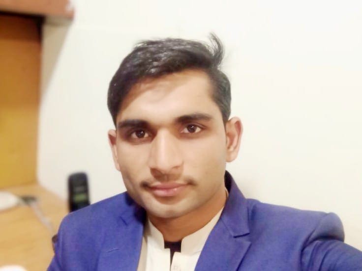 Founder of FabTechy Farman Ali is taking selfie in his Office