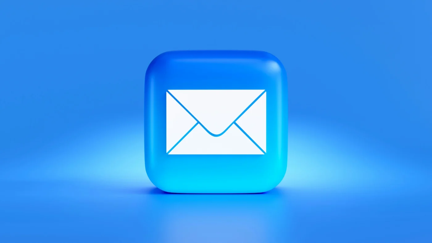A digital shield protecting an email envelope icon, surrounded by glowing security elements and abstract network graphics on a dark blue tech-inspired background representing email protection from hackers